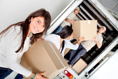 Packing team organizing fragile household items in Lissongrove