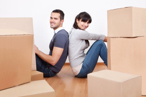 Removal team handling furniture during a Lissongrove flat move