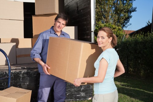 Packed boxes and furniture ready for storage in Lissongrove